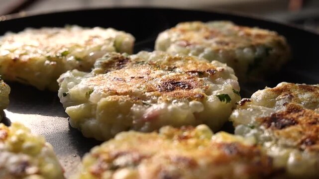 Sabudana tikki or vada being made on a pan