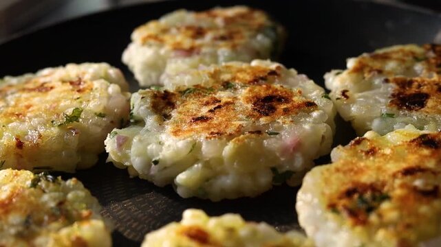 Sabudana tikki or vada being made on a pan