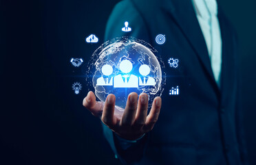 Businessman holding digital global network with human resources icons, representing global business, HR management, teamwork, leadership, data driven strategy, corporate growth in modern technology.