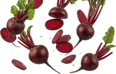 Several fresh raw whole beetroots with green leaves and bright red slices scattered around in motion beets vegetable root vegetable crimson magenta healthy organic food transparent background