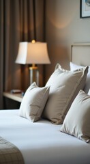 Hotel room with made bed