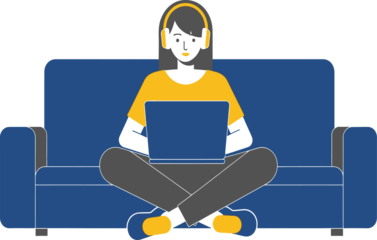 Young woman relaxing on couch with laptop and headphones