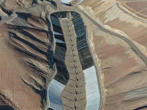 Aerial view of a landfill constructed with geosynthetic materials and monitoring towers