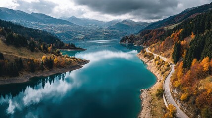Majestic lake surrounded by mountains and fall foliage, the perfect landscape for outdoor exploration.