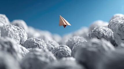 Fototapeta premium Paper plane flying among many crumpled paper balls, innovation and standing out concept, leadership idea 