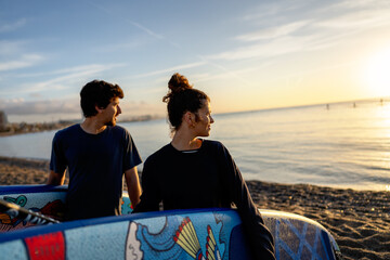 Paddle boarders moving calmly across the water at sunset, mindful outdoor moment with relaxation