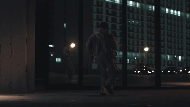 Cinematic street dance performance inspired by hiphop culture, powerful posture and sharp movement, layered urban textures without identifiable locations, controlled contrast lighting, realistic 
