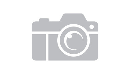 A simple gray silhouette of a photographic camera symbolizes photography, image capture, or media concepts, clearly isolated on a white background.