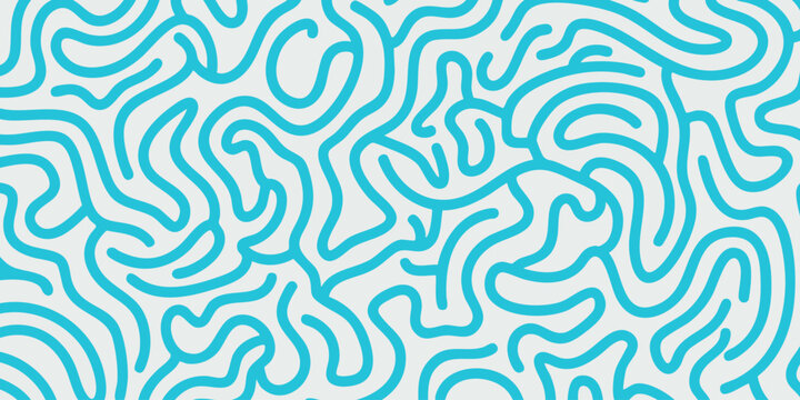 Intricate blue patterns swirling in an abstract design on a white surface viewed from directly above