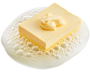 block of butter melting on water, isolated on white background.