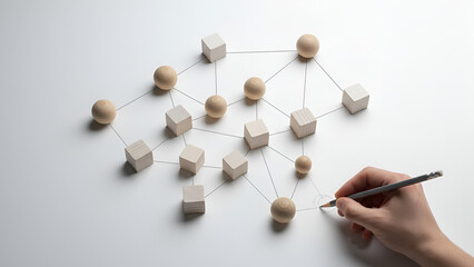 Obraz premium Network of wooden blocks concept — hand connecting nodes to form a collaborative grid