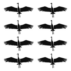 Obraz premium A repeating pattern of elegant cranes in flight depicted as a striking black silhouette high quality