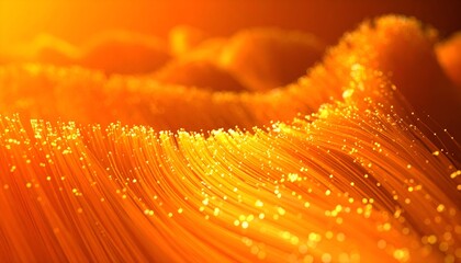 Illuminated bundle of fibers, glowing orange, with a shallow depth of field