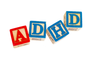Wooden blocks with the letters ADHD written on it