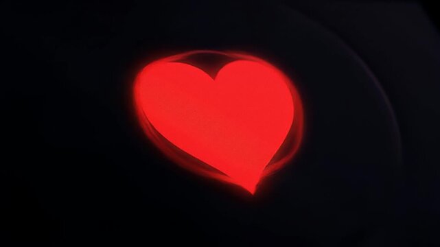Red Heart Shape Light on Dark Background for Love and Romance.