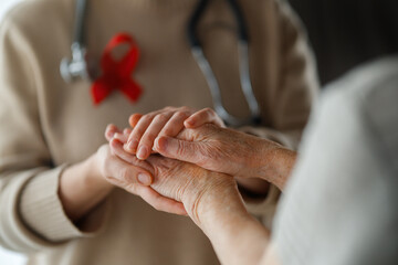 two women with a red ribbon