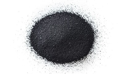 Dark granular substance spread on white surface in a circular shape