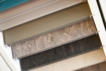 Samples of materials and colors for interior design, furniture and kitchen countertops.