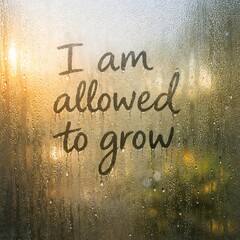 I Am Allowed to Grow Affirmation on Fogged Glass Representing Personal Growth and Self Permission