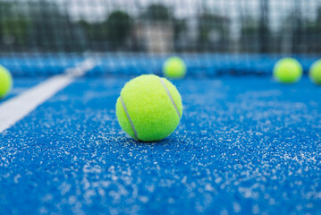 Selective Focus on Yellow Padel Ball on Blue Court The Concept of Match Point