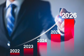 Businessman plan the growth 2026. Investment with financial chart, Growth and successful concept.