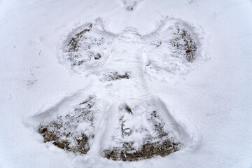 Winter holiday snow angel, top view