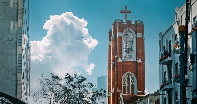 Towering Church with Cross Set Against Clear Sky in Urban Location Shanghai, China