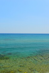Fototapeta premium Mediterranean Sea And Rocky Coast Of Crete, Greece 21.06.2023. This was on a hot, Sunny afternoon. Clear turquoise waters of the Mediterranean Sea.