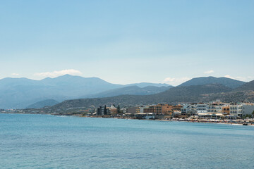 Fototapeta premium Mediterranean Sea And Rocky Coast Of Crete, Greece 21.06.2023. This was on a hot, Sunny afternoon. Clear turquoise waters of the Mediterranean Sea.