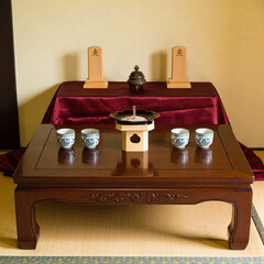 Traditional Japanese tea table with ceremonial items and cups  