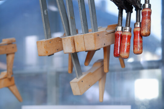 Wood clamps hanging in workshop in Schaeftlarn Upper Bavaria Germany