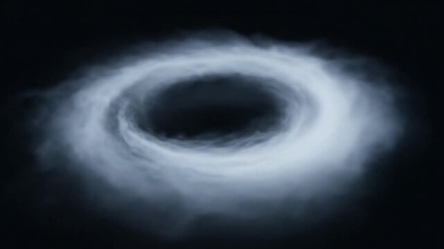 A swirling vortex of white mist against a dark background, captured from a frontal viewpoint, illustrating an abstract concept or phenomenon