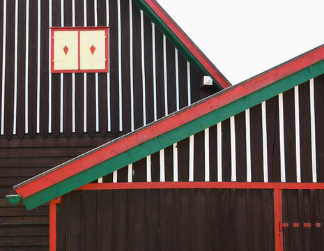 Striped wooden house facade with window in Wallersee, Austria