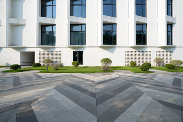 Minimalist white geometric architecture with tiled floor