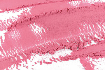 Beautiful wide strokes of delicate pink blush close-up. a loose sample of decorative cosmetics. Dry pink blush texture. cosmetic product template.