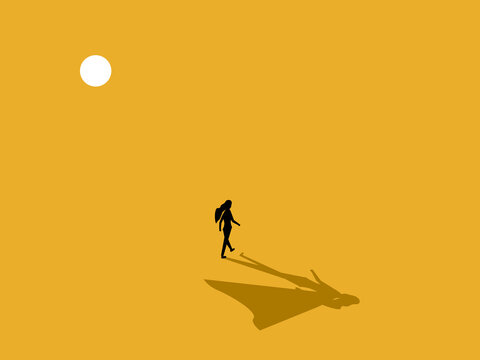 strong businesswoman walks with determination, accompanied by the shadow of hero..