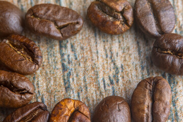 Obraz premium A close-up of coffee beans. A warm, abstract coffee-themed background. Photographed in soft focus at high magnification.