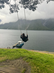 norway-fjord-swing-over-water-person