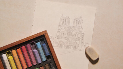 Discovering art supplies on a table for drawing the famous cathedral