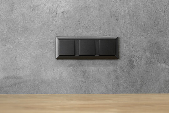 Modern electrical anthracite power socket and plug switched waterproof with cover.