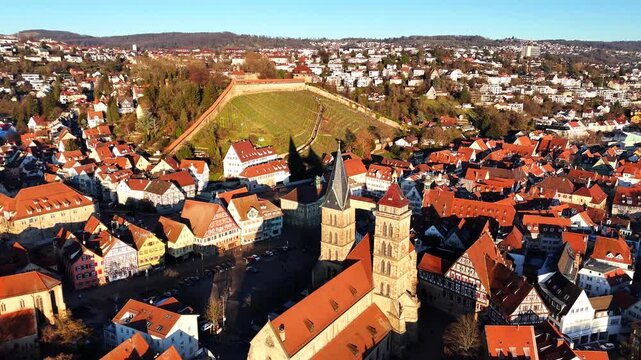 Aerial view reveals Esslingen am Neckar free imperial medieval city center with distinctive half-timbered architecture and church spires, Stuttgart region Baden-W&uuml;rttemberg, Germany, slow orbiting