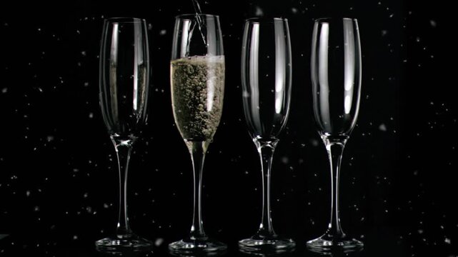 Animation of confetti falling over glasses of champagne