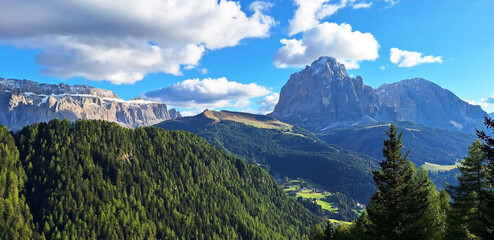 Fototapeta premium Panorama of the Dolomites mountain landscape on a summer day.