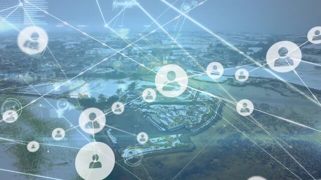 Animation of connected icons, soundwaves and data over aerial view of city