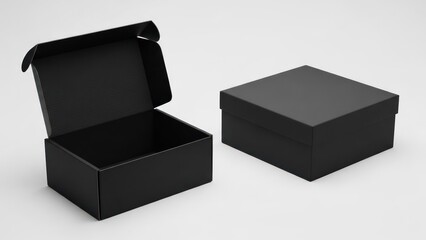 Two matte black cardboard boxes, one open, one closed on a bright surface