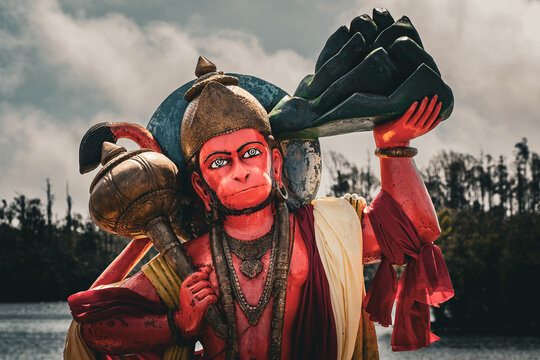 Beautiful view of a statue of the Hindu deity Hanuman on the shore of the sacred lake Ganga Talao, Grand Bassin, Mauritius