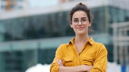 Confident Professional Portrait: A portrait of a sophisticated woman with eyeglasses, exuding a sense of confidence and poise against a modern architectural backdrop.