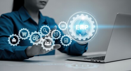 Businesswoman using ERP system interface on futuristic virtual screen for management efficiency and productivity