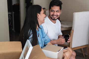 Happy couple achieving new home goal moving day