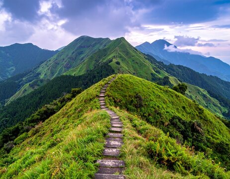Fairy tale landscape and stepping stone path over a hill on the horizon at the Caoling Historic Trail in Taiwan

